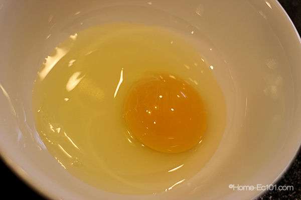 Crack the egg into a bowl